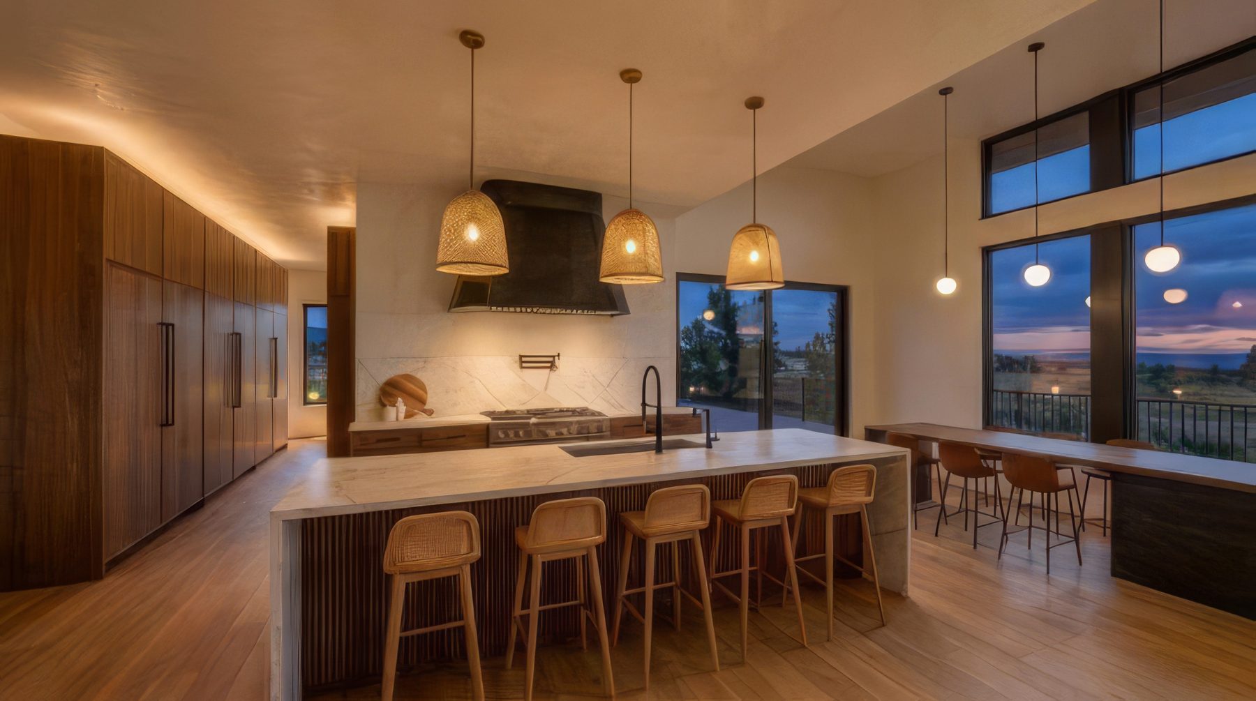 Rendering of the same kitchen in the evening, with the lamps lit and the sky darkening beyond the glass.